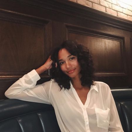 Greta Onieogou is at restaurant and posing for the photo.